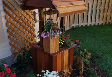 Custom made flower box made to resemble a working wishing well 