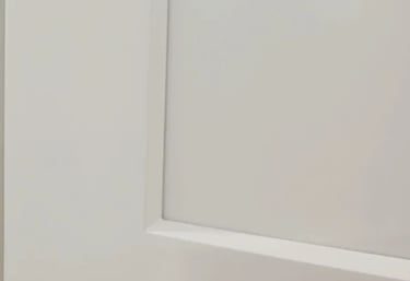 Close-up of white shaker cabinet with angled edge profile or Euro-Style