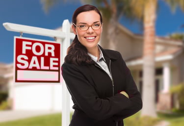Real Estate and For Sale Sign and House on Background