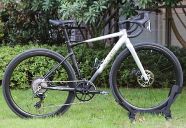 XDS RS500 road bike parked on a green lawn with carbon wheels and disc brakes.