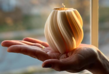 Hand holding a twisted candle