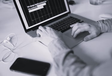 Image of a user typing on a laptop