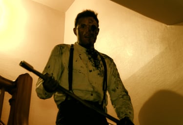 Threatening man walks down stairs, Nathan Green, 1000 Steps, 2020