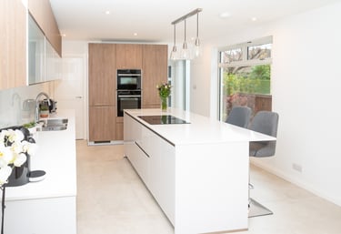 Bauformat white handless kitchen with a mix of wood