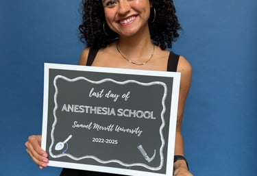 “Classic stand-alone photo booth with guest posing and smiling at a Graduation
