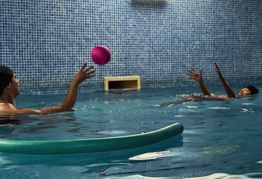 Instructor and child exchanging ball