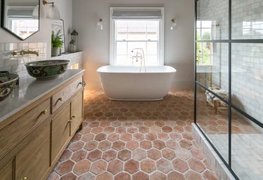 Terracotta bathroom floor, giving the space warmth and calming effect