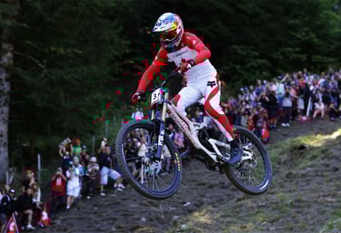 a person riding a bike on a hill