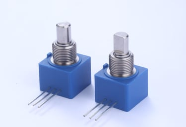 two small blue switches with a small one on the other