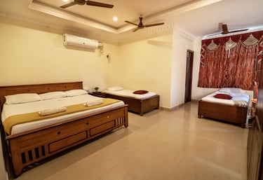 Spacious and clean deluxe room at Hotel Harish with modern amenities