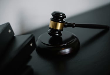 an anvil sits on the desk of a professional well versed with law