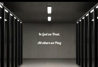 server racks in room with poster stating: In God We Trust, All Others We Ping