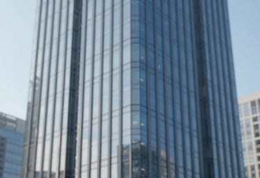 The exterior of a modern, luxury glass skyscraper corporate office, sharp lines, blue sky reflection, minimalist and high-end, incorporating #0A2342 and #F8F8F8.