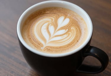 Close-up of a steaming cup of freshly brewed coffee on a rustic wooden table.