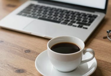 Modern office workspace with professionals collaborating over financial documents and laptops displaying tax software.