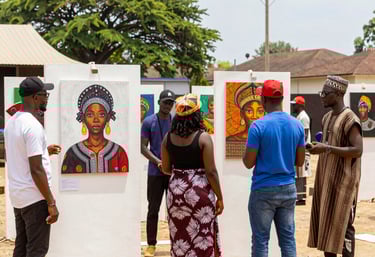 A serene gallery space bathed in natural light, featuring bold African artworks with visitors engaged in thoughtful appreciation.