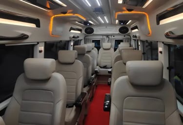 12 seater luxury tempo traveller interior for rent in Delhi with comfortable push back seats and amb
