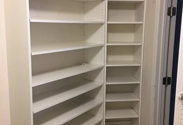 white walk-in closet shelves.