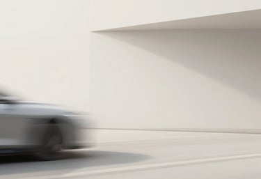 A sleek, dark-themed workspace with a laptop displaying the nexaura homepage, surrounded by subtle gold accents.