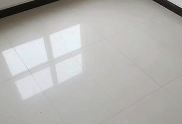 Close-up of skilled craftsmen applying precise tile work in a sophisticated interior.