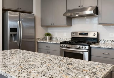 A pristine, modern kitchen with granite countertops and stainless steel appliances in a Latinoamericano home, professional lighting, extremely clean.