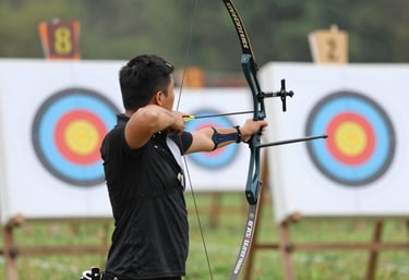 A person smiling while checking their phone, feeling accomplished and motivated.