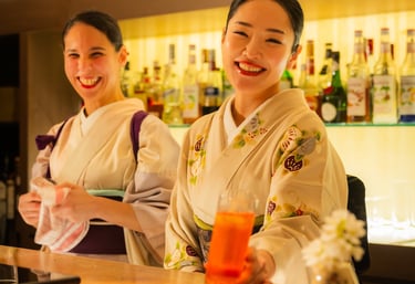 Women dressed in Kimono serving beautiful cocktails