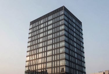 A modern and accessible office building in a Latin American / Spanish city city, clean architecture, pale mist sky, professional photography, high contrast.