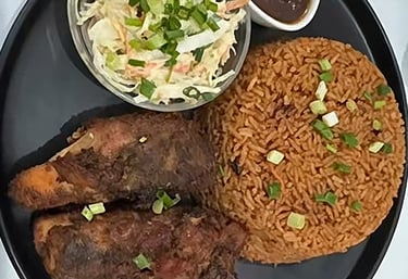 Jollof Rice, chicken, salad, and Shito