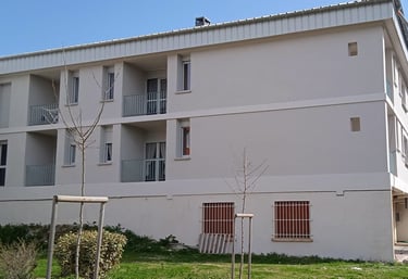 a building with a playground structure and a playground structure