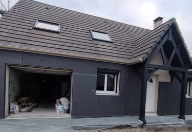 a house with a garage door and a garage door