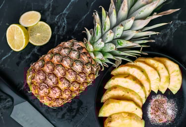 a pineapple with sliced pineapples and lemon