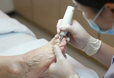 A podiatrist carefully examining a runner's foot in a bright clinic room.