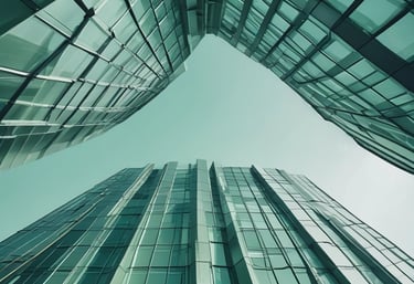 Close-up of modern glass buildings with intricate architectural lines against a cloudy London sky.