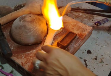 Tourist forging silver to make emerald ring in Bogota workshop