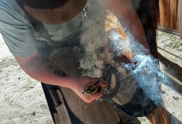 Mason hot shoeing a horse