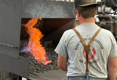 Rafter MC firing a shoe in the forge