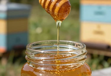 A sun-drenched close-up shot in a North American / US apiary showing golden liquid honey dripping slowly from a wooden dipper into a crystal glass jar.