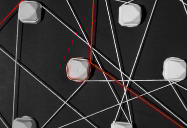 Interconnected web of white and red strings representing complex data network connections on a black background.