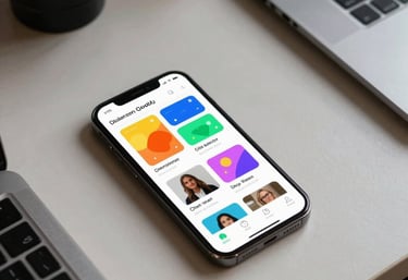Clean, high-angle shot of a digital designer's desk in a North American / US creative space. A smartphone displays a colorful, approachable app prototype.