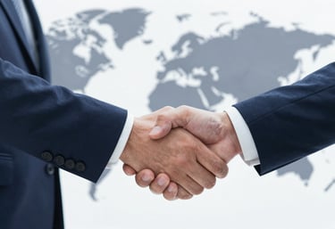 Close-up of a professional handshake between two business people in front of a world map, representing trust and partnership, with #0A1F28 palette.
