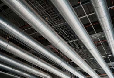 Indian commercial building complex interior showcasing flawlessly routed electrical ducts and pristine cable trays running along structured ceiling grids, modern engineering precision.