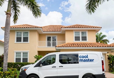 A skilled HVAC technician carefully installing a sleek air conditioning unit in a modern South Florida home.