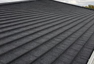 Storm-damaged roof being carefully inspected by an experienced roofer.