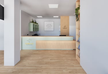 Heller, moderner Empfangsbereich einer Frauenarztpraxis (GYNPLUS) im 21. Bezirk mit Holz- und Pastel