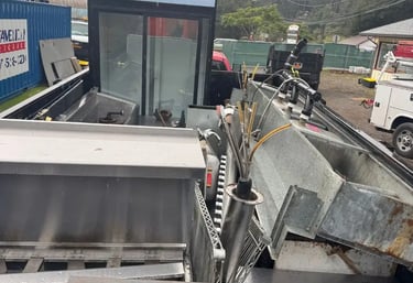 trailer full of restaurant appliances like refrigerator, sink, stove