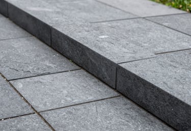 Detailed shot of high-quality garden edging and clean pressure-washed stone in a Oceanic / Australian (Victoria) patio.