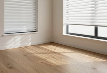 A bright living space showing integrated flooring and modern blinds. The design is contemporary Oceanic style, emphasizing the connection between different home improvement services like flooring and window treatments.