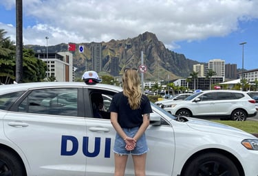 Close-up of legal documents and a gavel on a wooden desk, highlighting serious defense work.