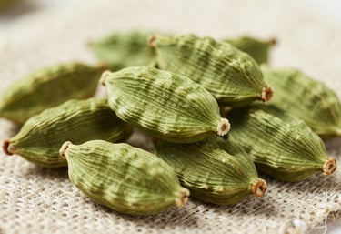Macro photography of bright green cardamom pods piled on a piece of natural linen. Soft, sophisticated lighting highlights the texture and vibrant muted green color. High-end product photography.